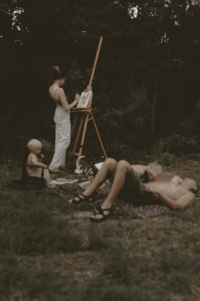 Woman cools off while painting during a documentary style intimate photo session in Wilmington, North Carolina